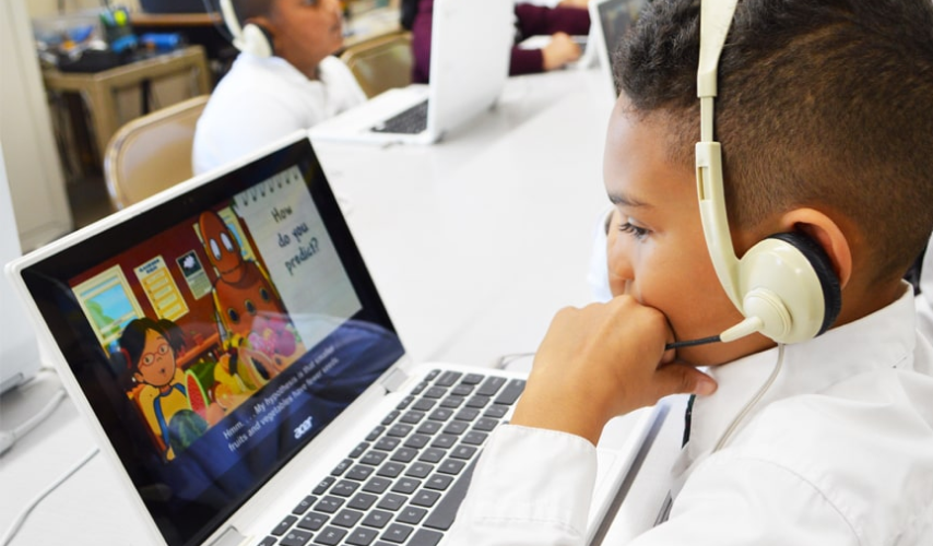 student looking at laptop screen